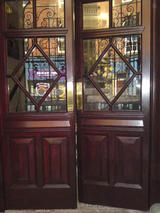 Office entrance doors of mahogany construction after restoration.