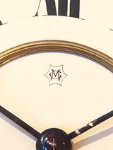 Manufacturers monogram on dial.