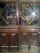 Mahogany entrance doors, prior to restoration.